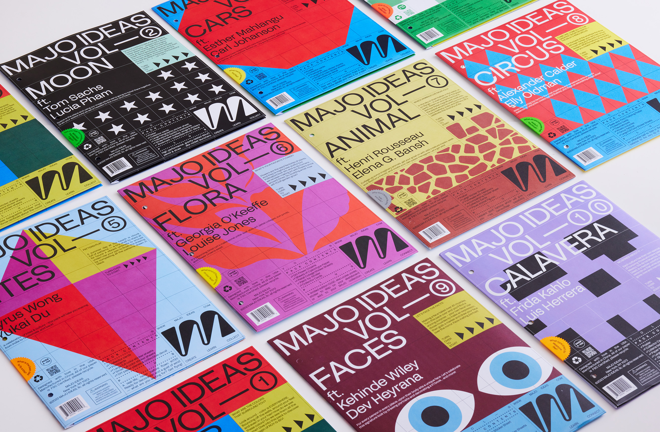 Twelve Majo Ideas volume covers laid out together, each a different colorway.